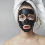 combination skin - woman with charcoal face mask on her face