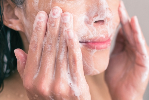 woman cleansing skin
