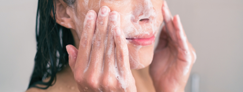 woman cleansing skin