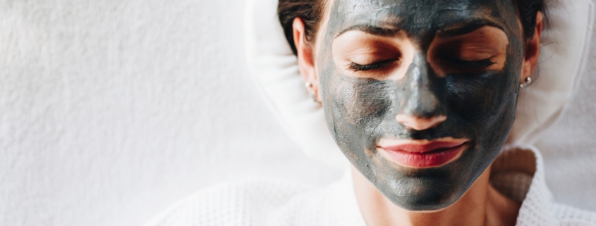 Beauty Collective - multi-masking - woman with charcoal mask on her face