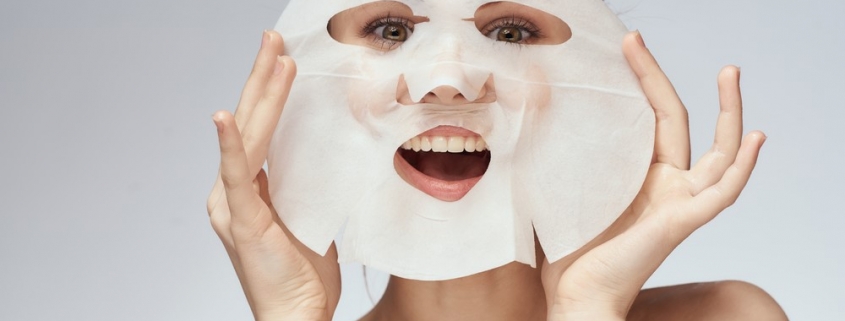 woman with sheet mask on her face