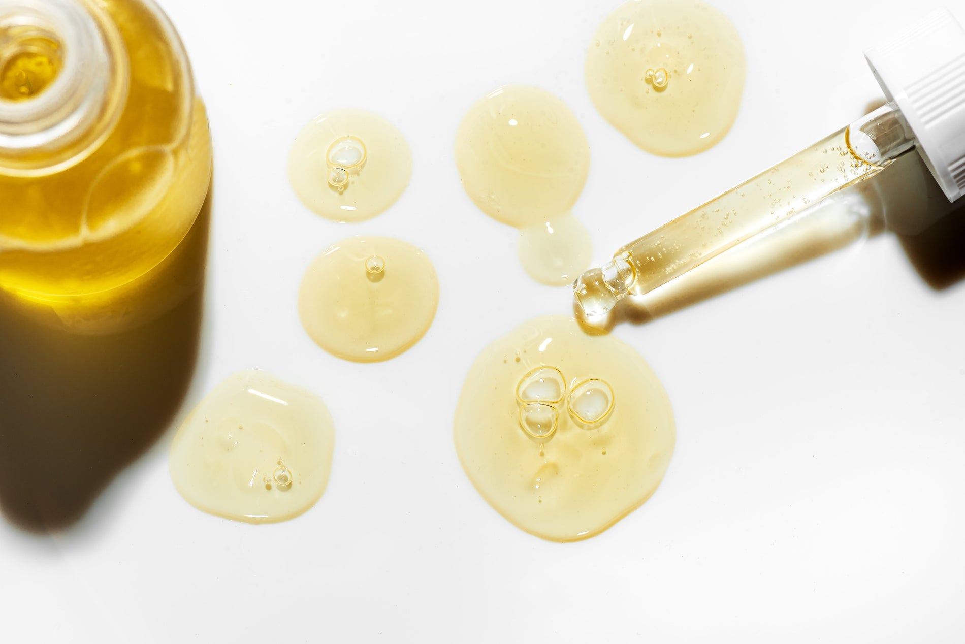 golden serum, white dropper