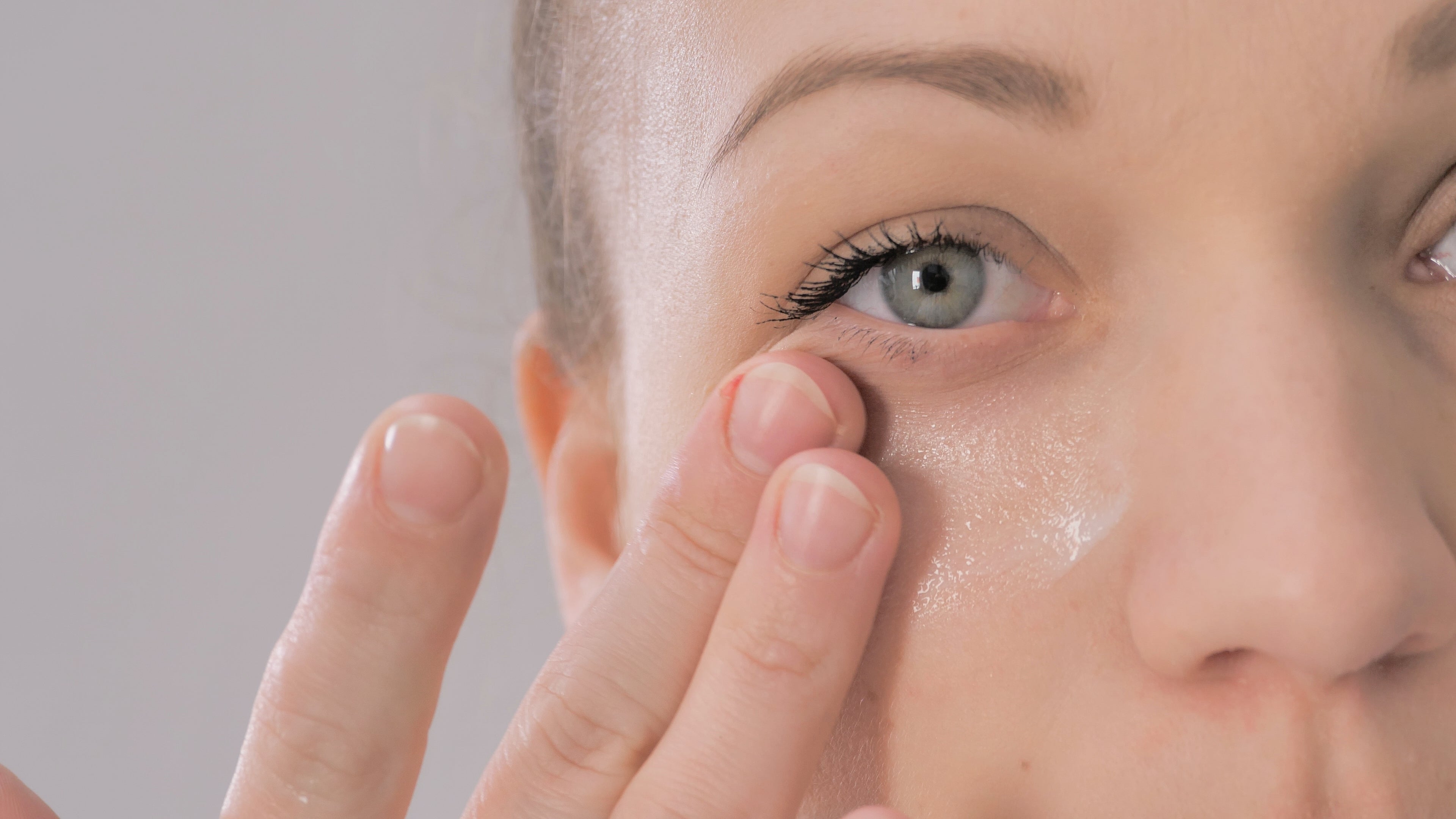 Woman with bright, refreshed eyes after using skincare eye treatment