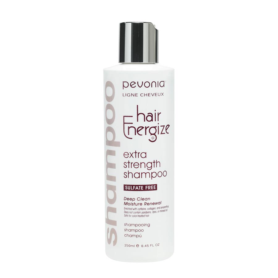 Bottle of Pevonia Hair Energize Extra-Strength Shampoo, with a white and silver label, indicating it is a strengthening hair shampoo, silicate-free, and with added caffeine.