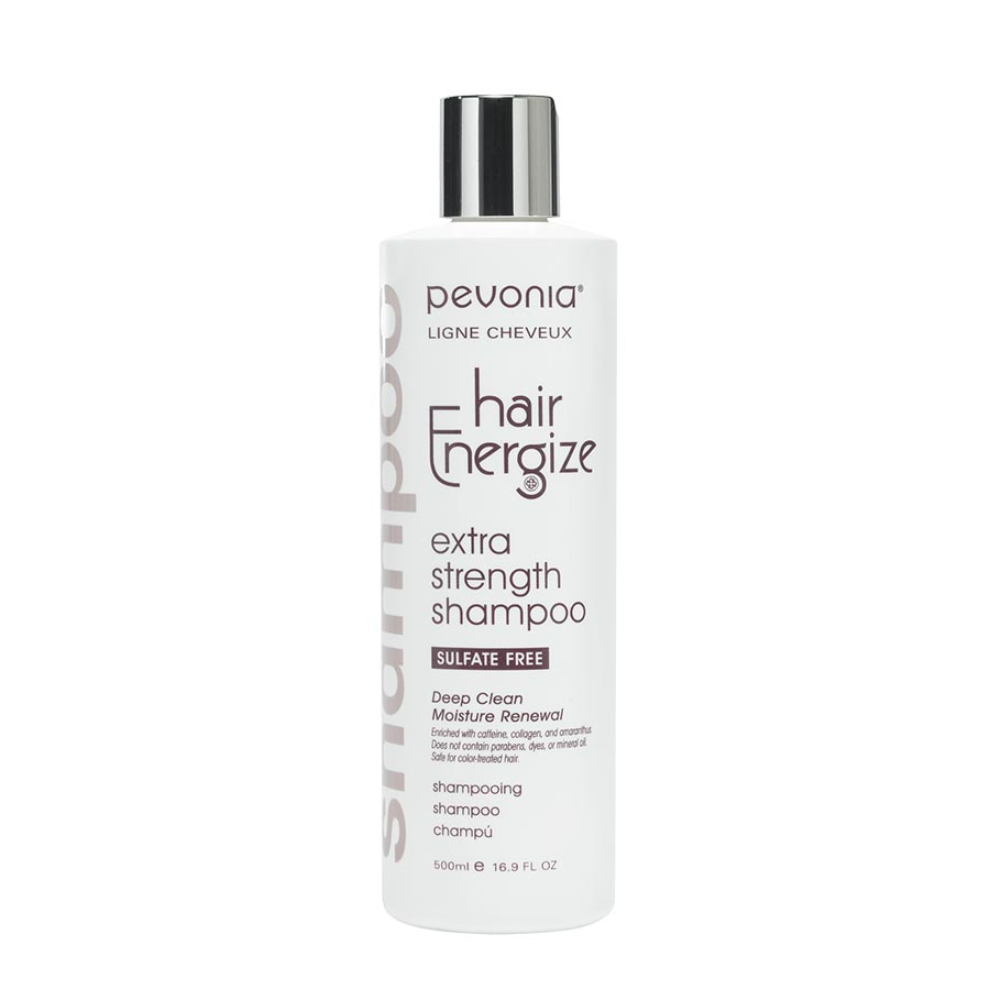 Bottle of Pevonia Hair Energize Extra-Strength Shampoo, with a white and silver label, indicating it is a strengthening hair shampoo, silicate-free, and with added caffeine.