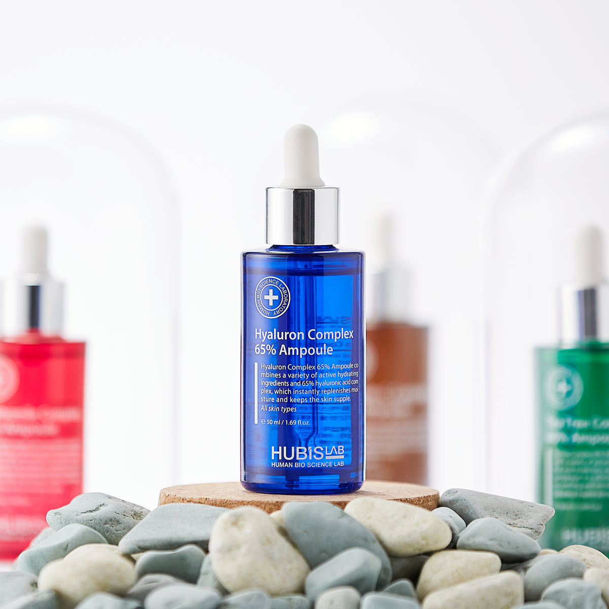 Hubislab Moisture Max Hyaluron Complex 65% Ampoule 50ml context image sowing the product displayed on pebbles