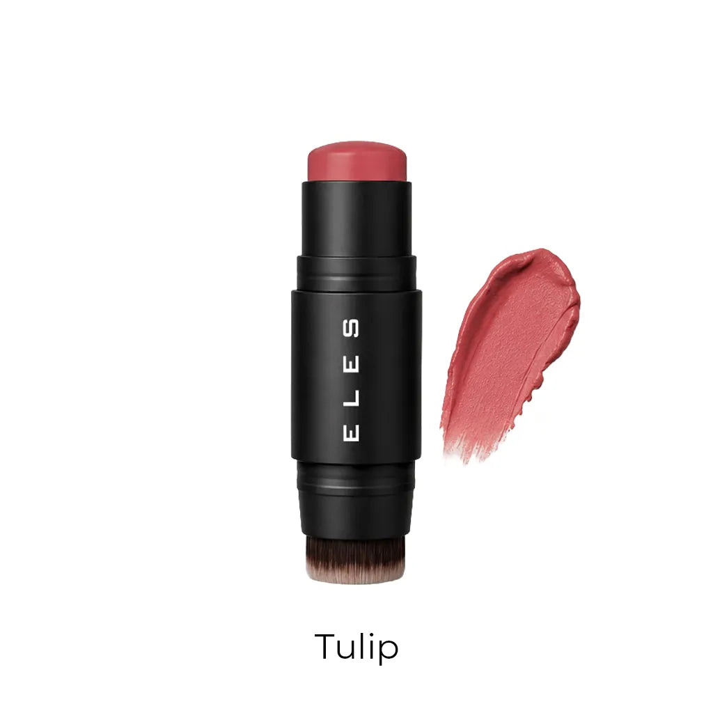 ELES lip blush stick in the shade Tulip, featuring a black cylindrical tube with white brand lettering and a swatch of the dusty rose pink product on the right, set against a plain white background.
