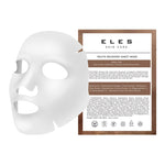 A packaged ELES Skin Care Youth Recovery Sheet Mask with a white sheet mask displayed in front of its packaging. The packaging contains product information and is labeled as vegan, cruelty-free, fragrance-free, and sulphate-free.