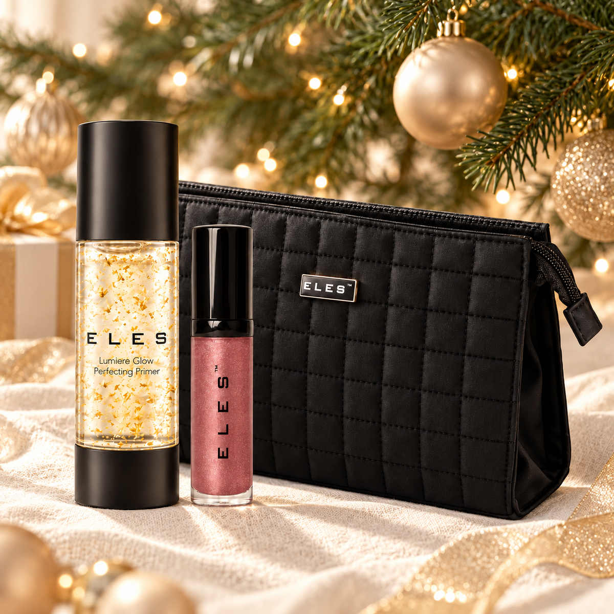 ELES Lumiere Glow Perfecting Primer, Demure Colour Balm and black quilted cosmetics bag beside a Christmas tree and gold decorations.