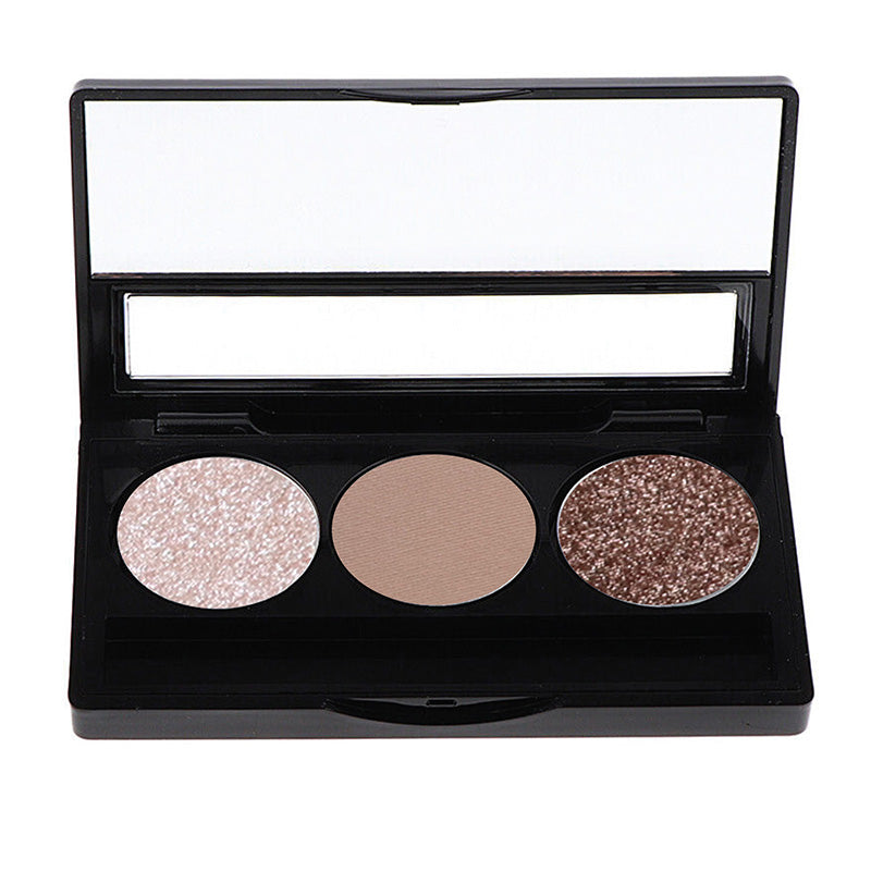 A palette with three shades of eyeshadow, featuring a range of colors from natural to bold, displayed in a black case.