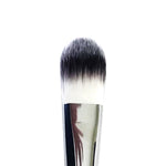 A flat foundation brush with a white handle and synthetic bristles, positioned with the brush head up.