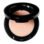 Compact powder in a black case on a white background