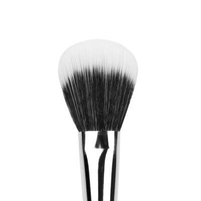 Makeup brush with black and white bristles on a white background