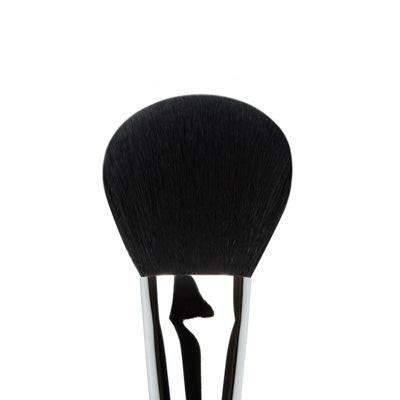 Makeup brush with black bristle head on a white background