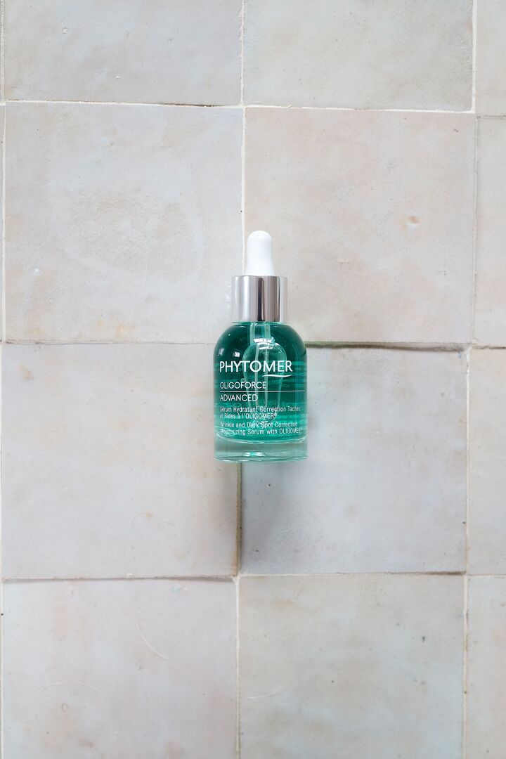 Bottle of Phytomer Oligoforce Advanced Serum 30ml on a tiled wall