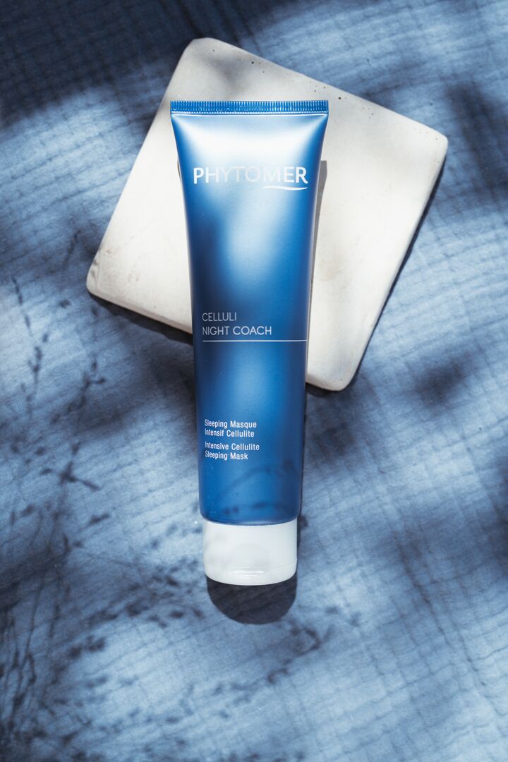 PHYTOMER Celluli Night Coach Intensive Cellulite Sleeping Mask on a textured blue surface