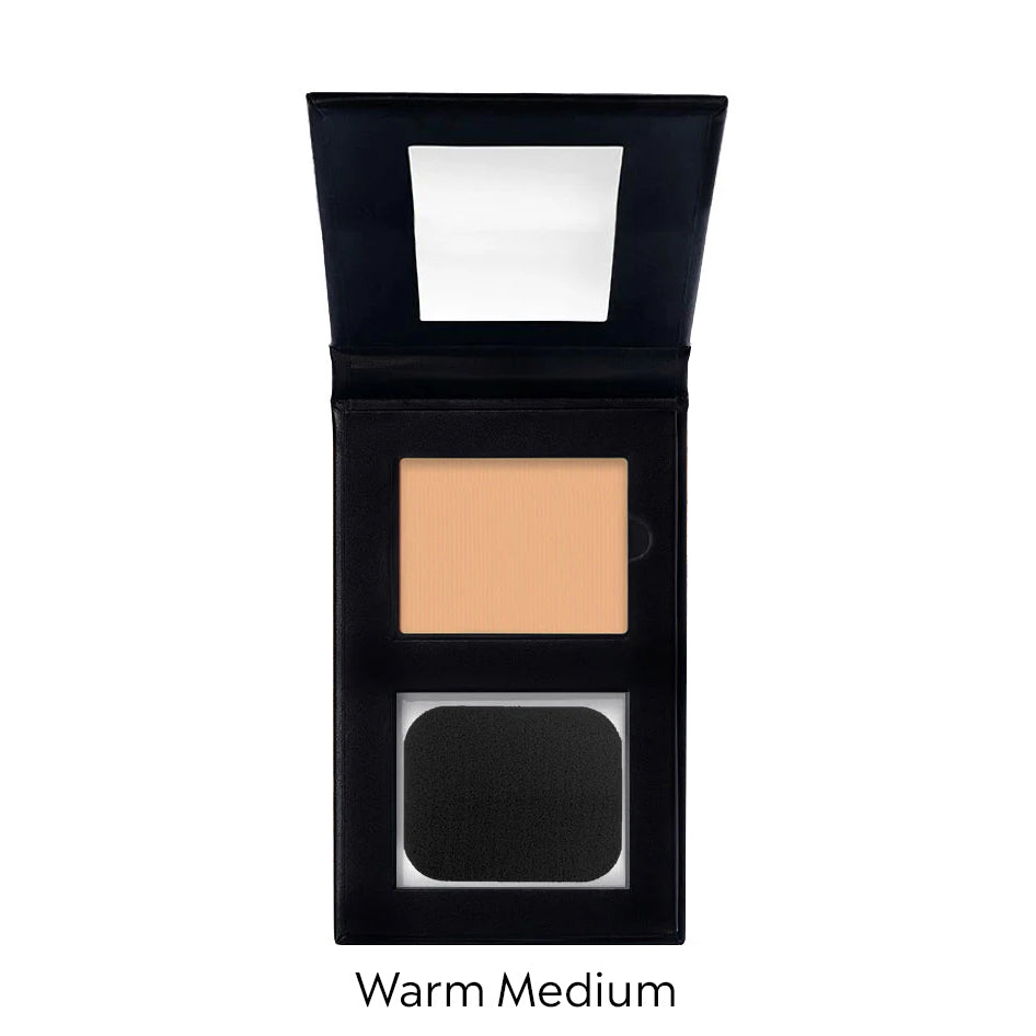 Compact makeup powder in a black case with a mirror on a white background, labeled 'Warm Medium'.