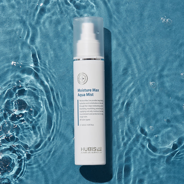 Moisture Max Aqua Mist bottle on a blue water background