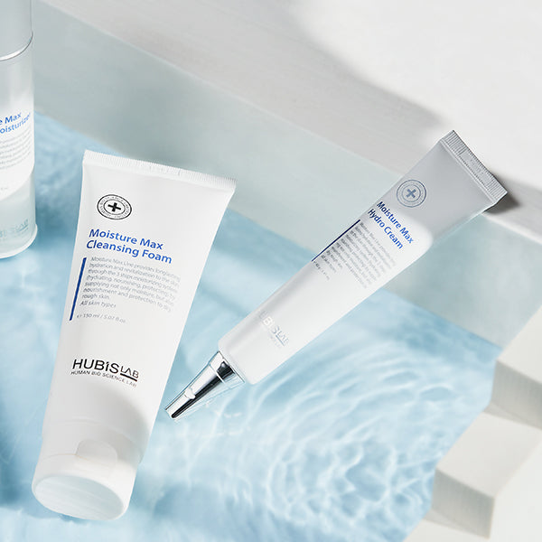 Two skincare products, 'Moisture Max Cleansing Foam' and 'Moisture Max Hydro Cream', on a light blue water background.