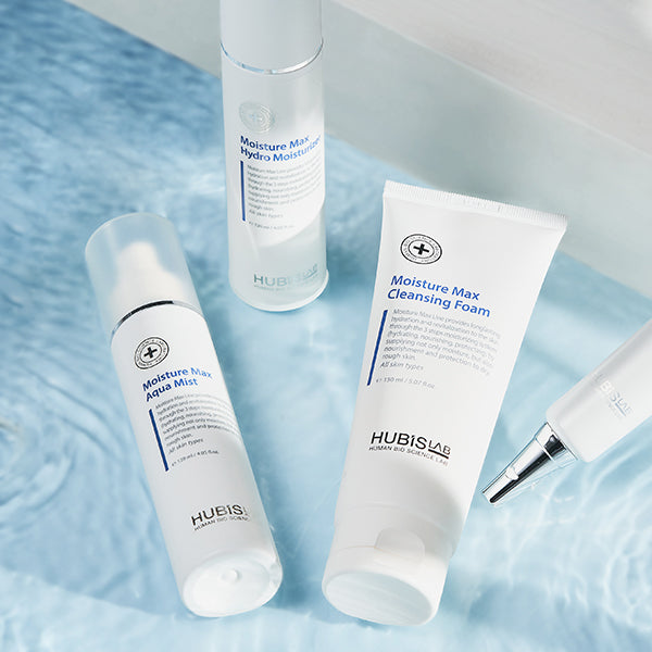 Moisture Max skincare line products group image on a blue textured surface