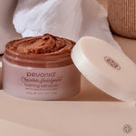 Pevonia Chocolate Indulgence foaming salt scrub with a white spatula on a beige background