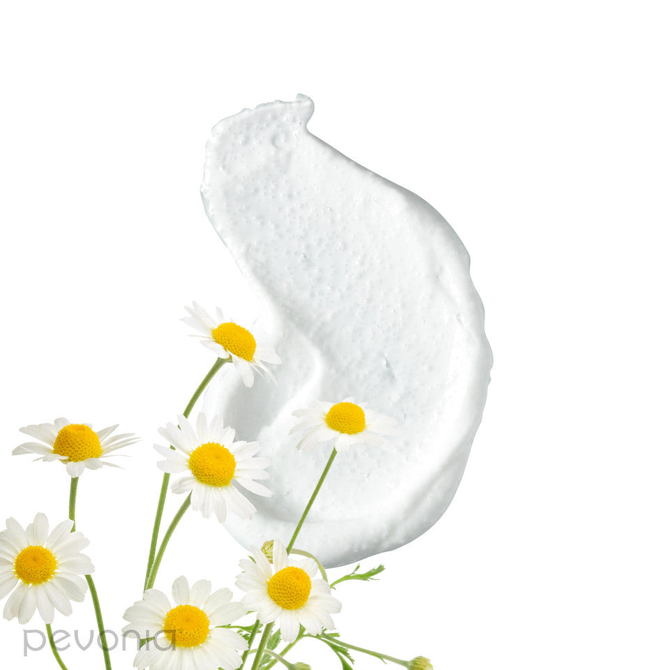 Pevonia Silky Skin body scrub ingredients shoeing White cream smear with daisies on a white background