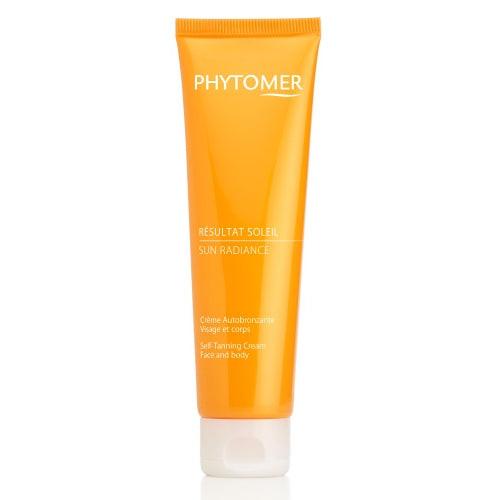 Orange tube of Phytomer self-tanning cream on a white background