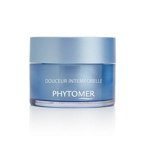 Blue jar of Phytomer skincare product on a white background