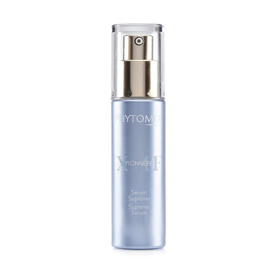 A clear glass bottle with a pump dispenser containing a blue-tinted serum, labeled as 'Pionniere XMF - Wrinkle and Dark Spot Supreme Serum 30ml'.
