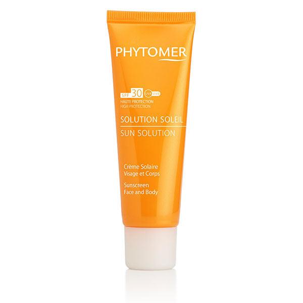 Orange sunscreen tube with 'Phytomer' branding on a white background