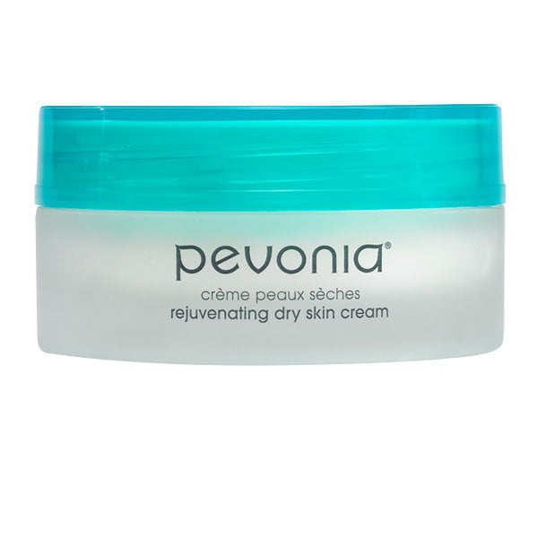 A jar of Pevonia rejuvenating dry skin cream with a green lid on a white background.