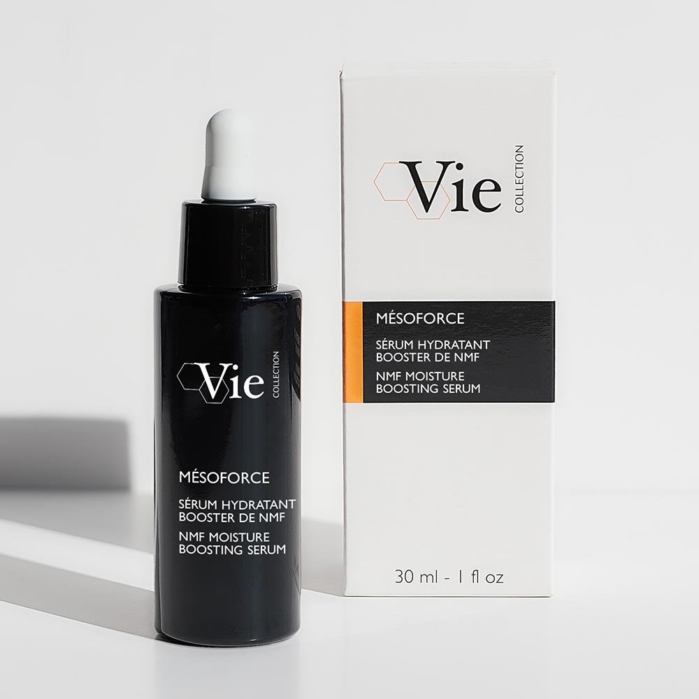 A black bottle with a white dropper labeled 'Vie' containing the Mesoforce NMF Moisture Boosting Serum.