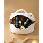 NIGHT BALM cream and Hydra Volume lip serum in a white Vie Collection pouch with gold Christmas decorations