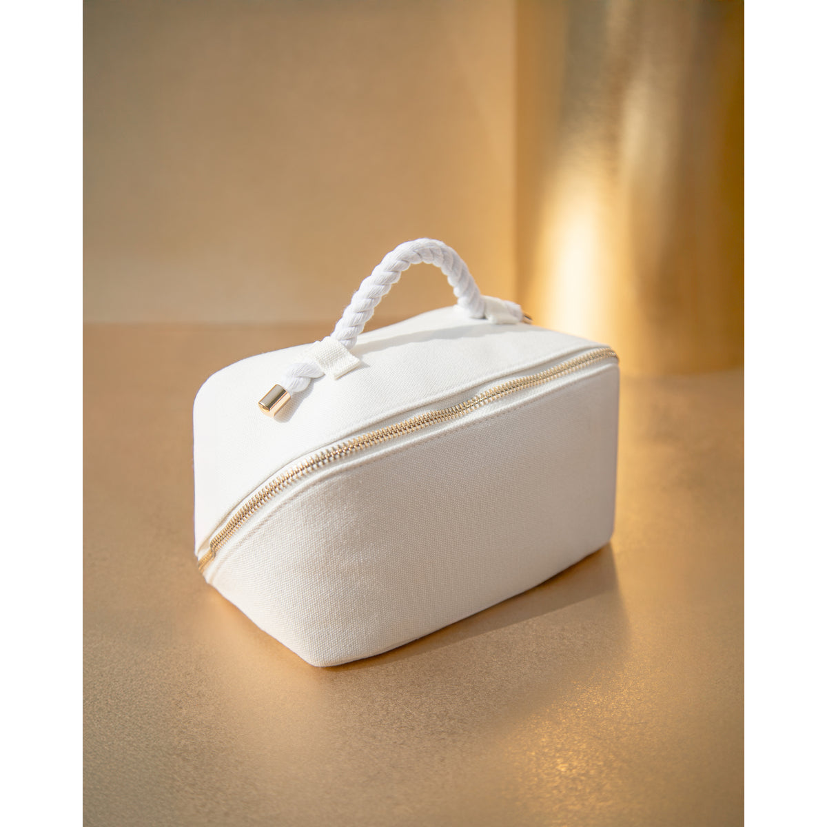 White Vie Collection cosmetics pouch with gold zip and carry handle
