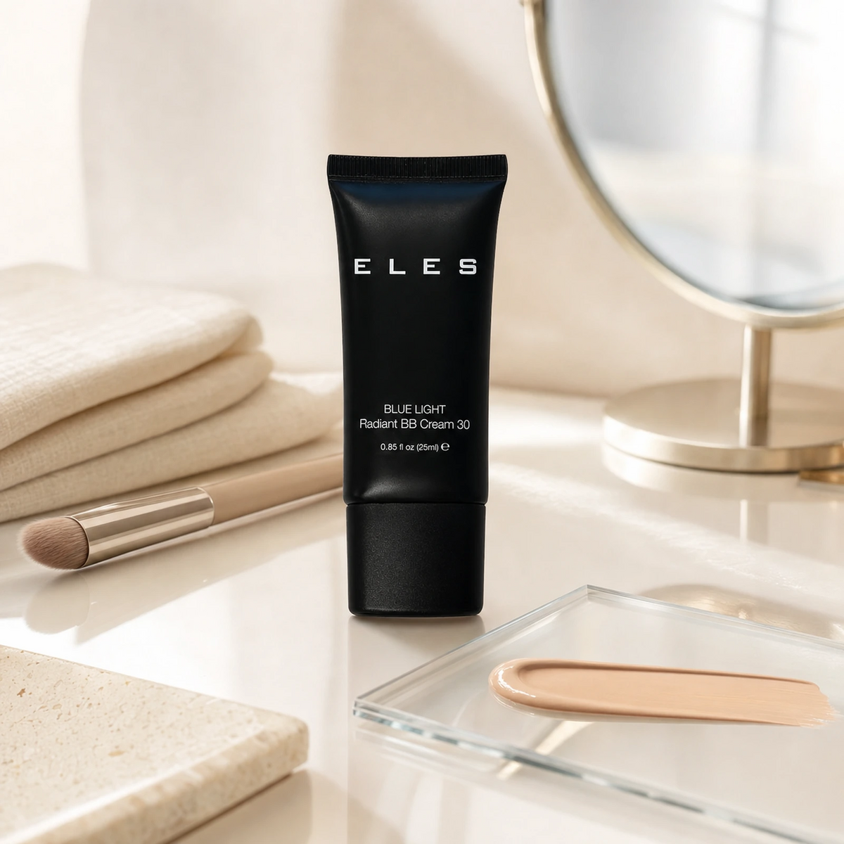 ELES Blue Light Radiant BB Cream 30 25ml displayed on a premium makeup vanity with a complexion swatch on a clear palette.