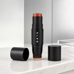 A Cheek & Lip Cream Blush 7g, standing upright on a white marble surface. The brand name 'ELES' is printed vertically on the tube.