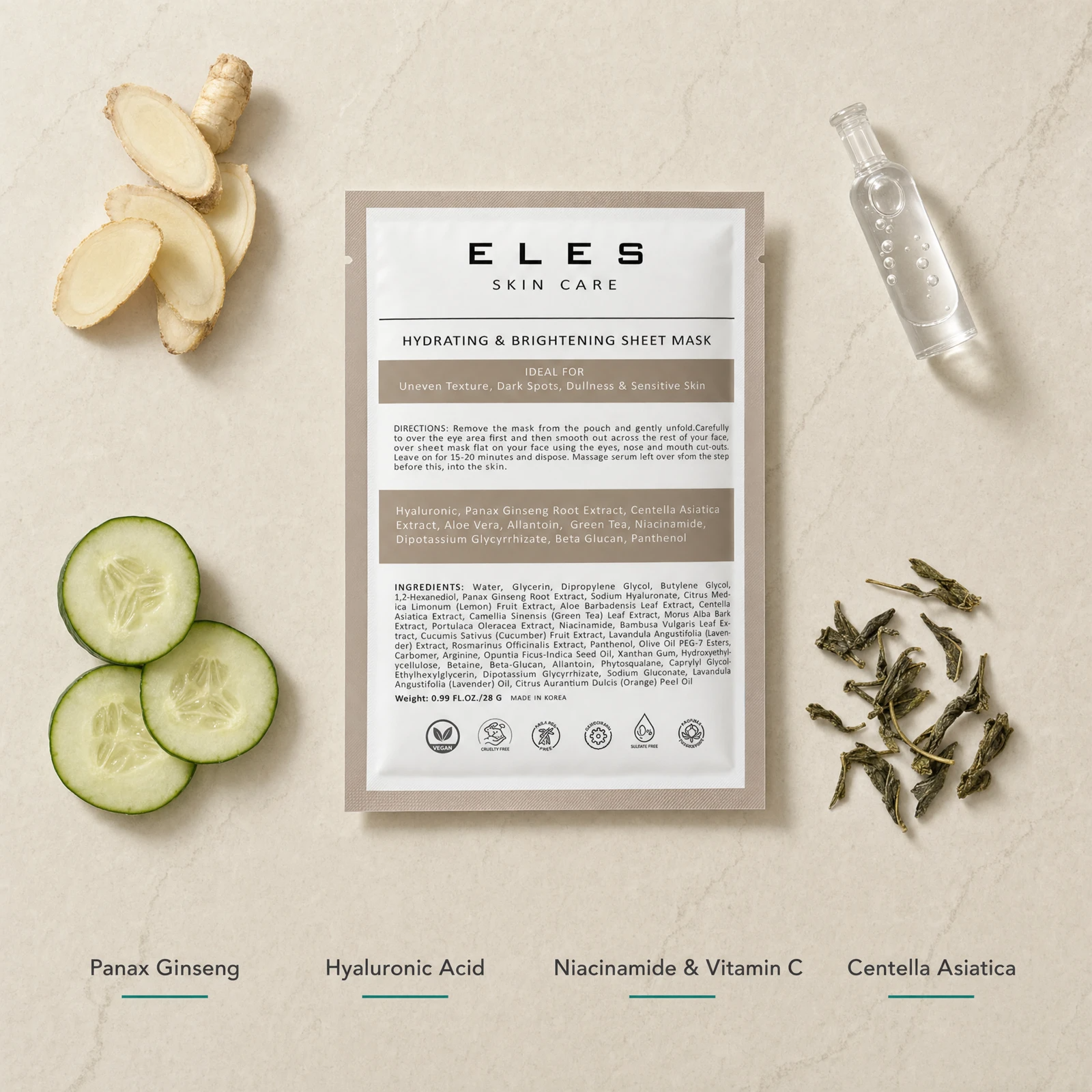 ELES Hydrating and Brightening Sheet Mask ingredient flatlay featuring Panax ginseng, hyaluronic acid, niacinamide and vitamin C, and centella asiatica with fresh ginseng root, cucumber slices and green tea on a warm limestone surface