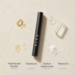 ELES Lash Fortify Waterproof Mascara Black ingredient flatlay featuring hydrolyzed keratin, panthenol, sodium hyaluronate and vitamin E on a warm limestone surface