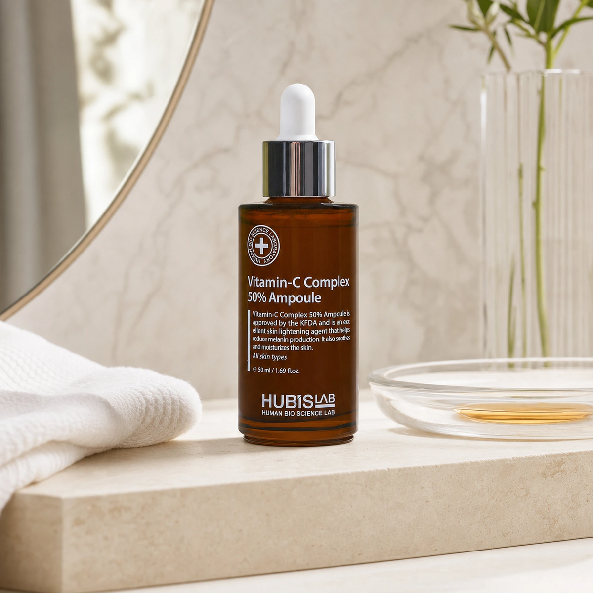 Hubislab Derma Max Vitamin-C Complex 50% Ampoule 50ml displayed on a clean premium bathroom vanity with a soft towel and amber serum cue.