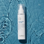Moisture Max Aqua Mist bottle 120ml on a blue water background