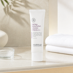 Hubislab Post Rays Derma Perfect Sunscreen SPF50 PA++++ 50g displayed on a clean premium bathroom vanity with soft towels and subtle sunlight styling.