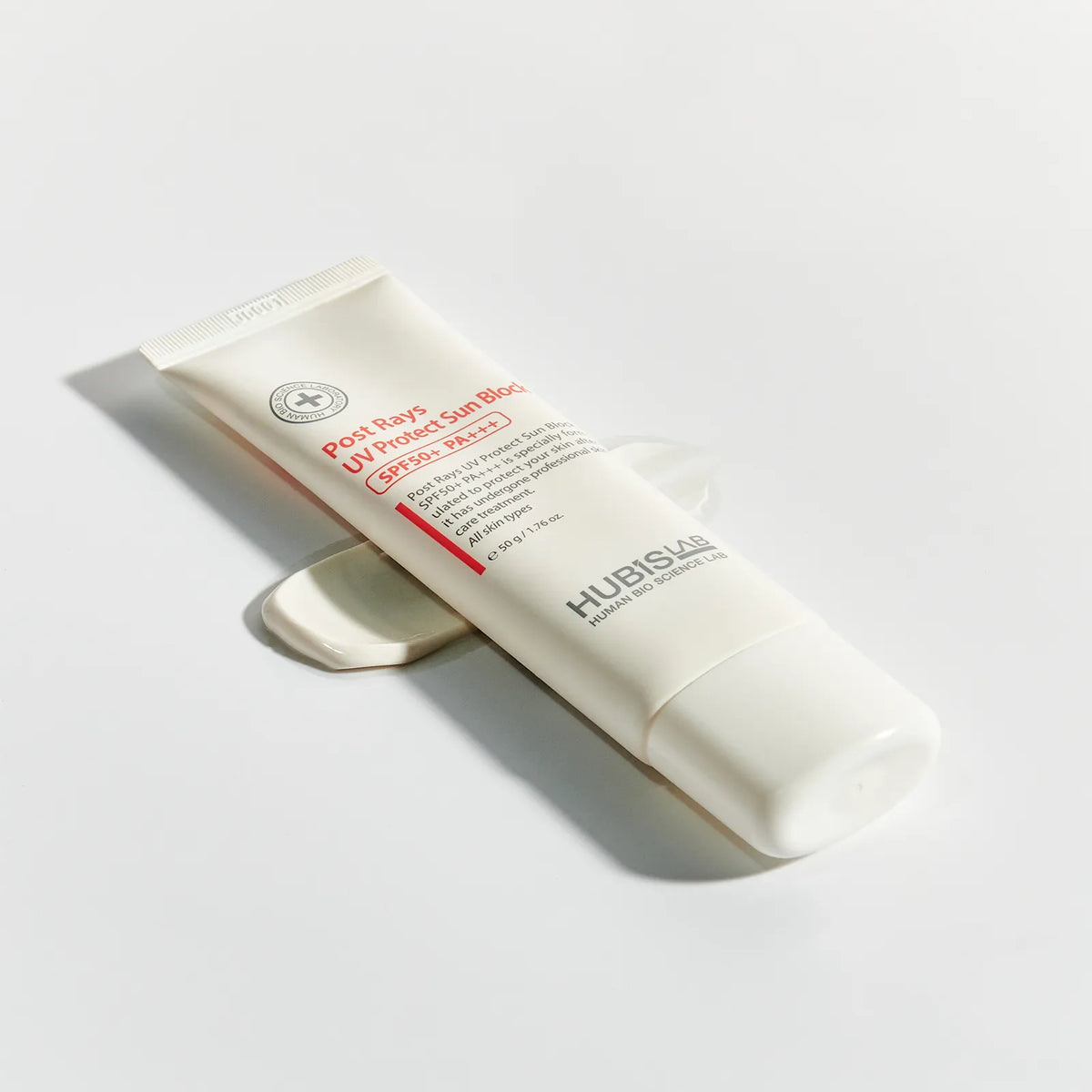 Tube of HUBISAS skincare product on a light gray background