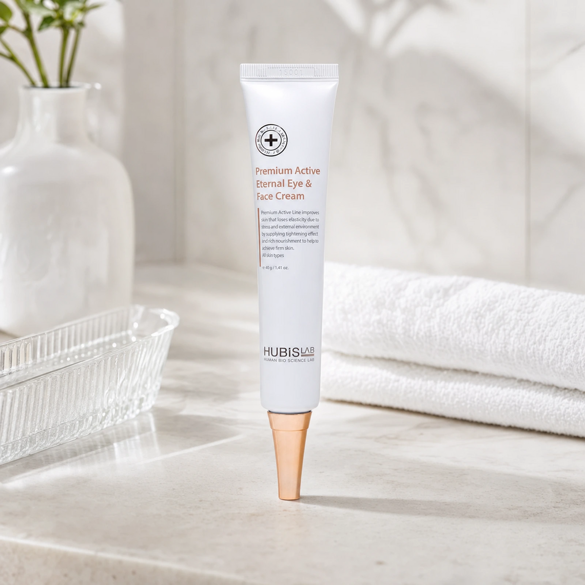 Hubislab Premium Active Eternal Eye & Face Cream 40g displayed on a clean premium bathroom vanity with soft towels and clinical-luxury styling.