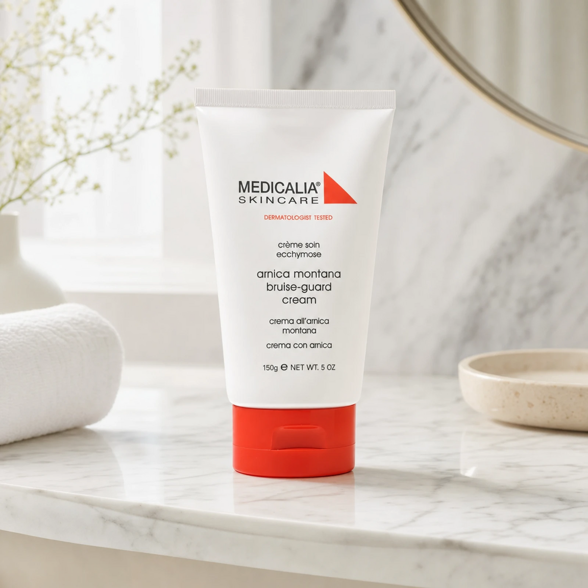 Medicalia Arnica Montana Bruise-Guard Cream 150g on a premium marble bathroom vanity, an advanced healing cream that reduces bruising, swelling, and supports post-procedure skin recovery.