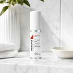 Medicalia C Serum with Oxyzomes 15ml on a premium marble bathroom vanity, a potent Vitamin C serum with oxyzome encapsulation technology for brightening, firming, and fading hyperpigmentation.