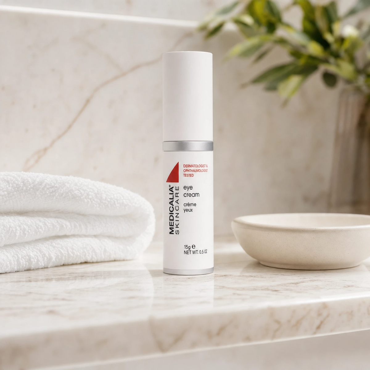 Medicalia Eye Cream 15g on a premium marble bathroom vanity, a nourishing firming eye cream for fine lines, dryness, and delicate under-eye skin.