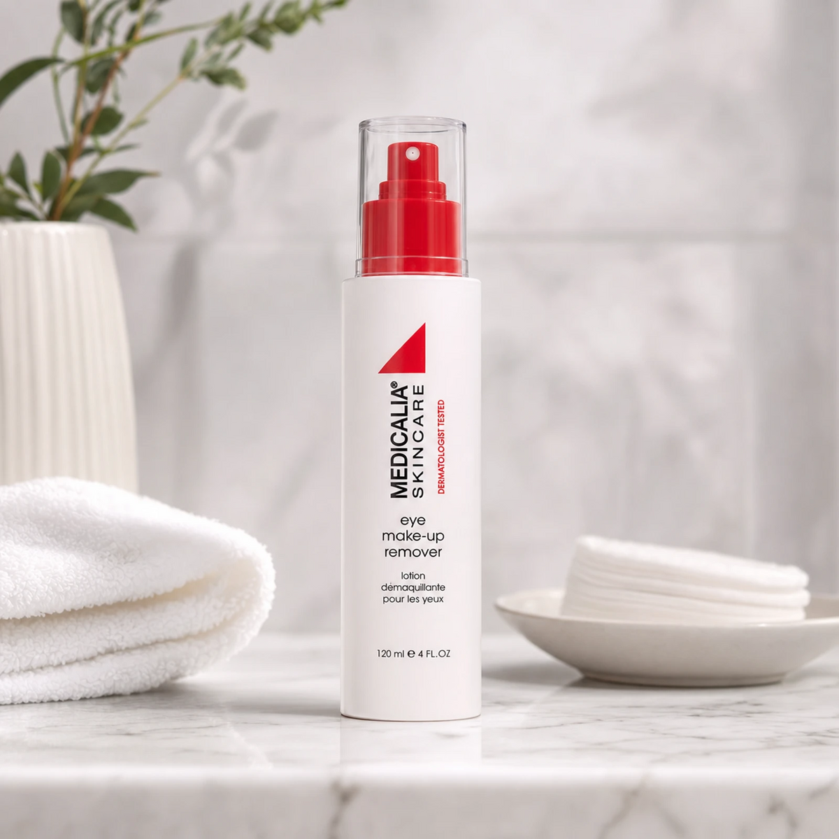 Medicalia Eye Make-Up Remover 120ml on a premium marble bathroom vanity with cotton pads, a gentle hydrating eye makeup remover for all skin types including sensitive and post-procedure.
