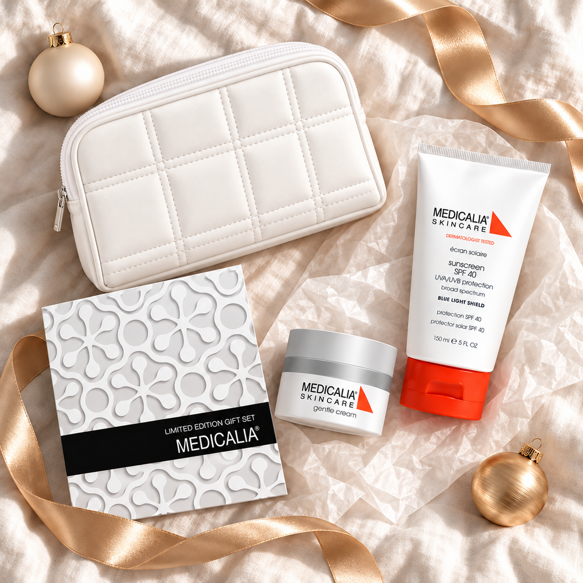 MEDICALIA Gentle Cream & Sunscreen Gift Bag arranged in a festive flatlay. File: medicalia-gentle-cream-and-sunscreen-gift-bag-christmas-flatlay-2026.png