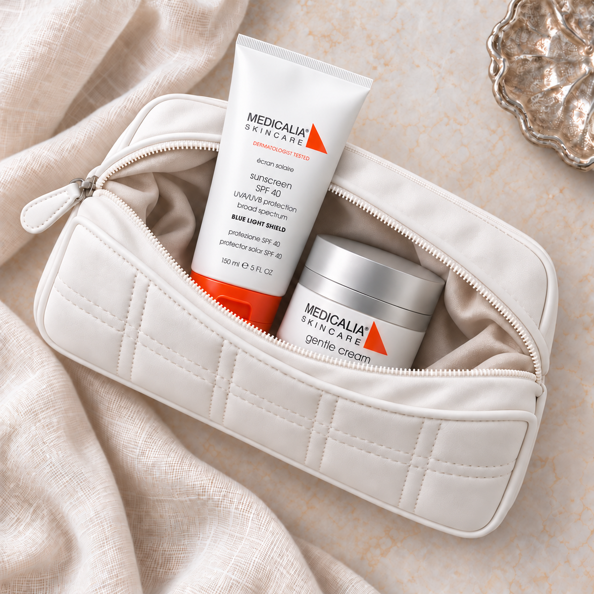 MEDICALIA Gentle Cream & Sunscreen Gift Bag with the gift pouch open. File: medicalia-gentle-cream-and-sunscreen-gift-bag-open-pouch-2026.png