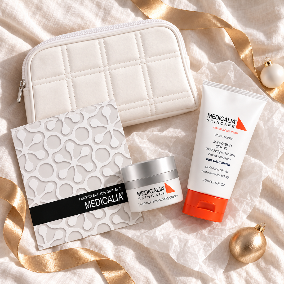 MEDICALIA L-Retinol & Sunscreen Gift Bag arranged in a festive flatlay. File: medicalia-l-retinol-and-sunscreen-gift-bag-christmas-flatlay-2026.png